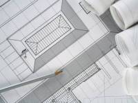 bigstockphoto_Architect_Plans_And_Rolls_1697848